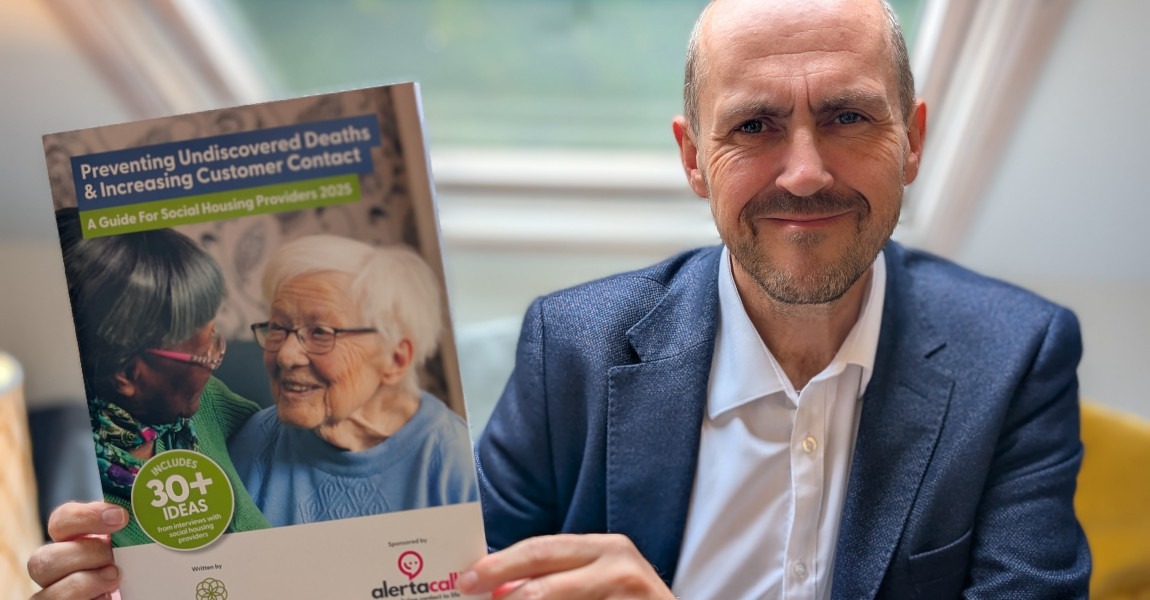Photo of James Batchelor MBE holding Preventing Undiscovered Deaths & Increasing Customer Contact Guide